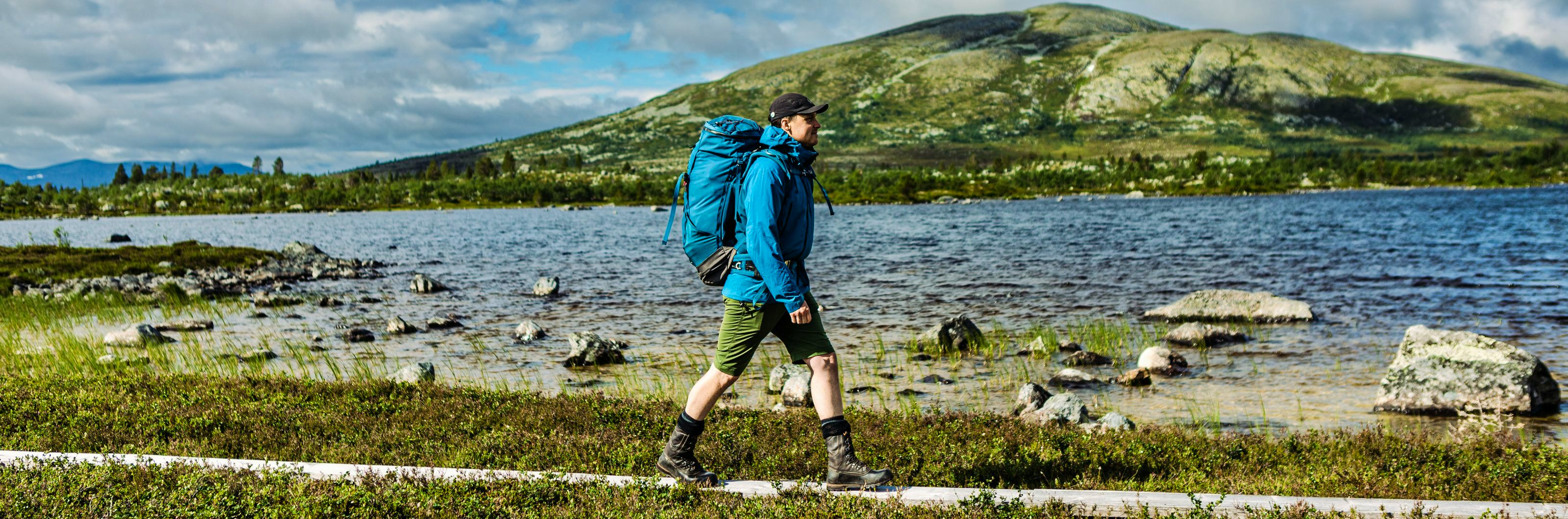 A hiker in the mountains of Rogen just by a lake. 