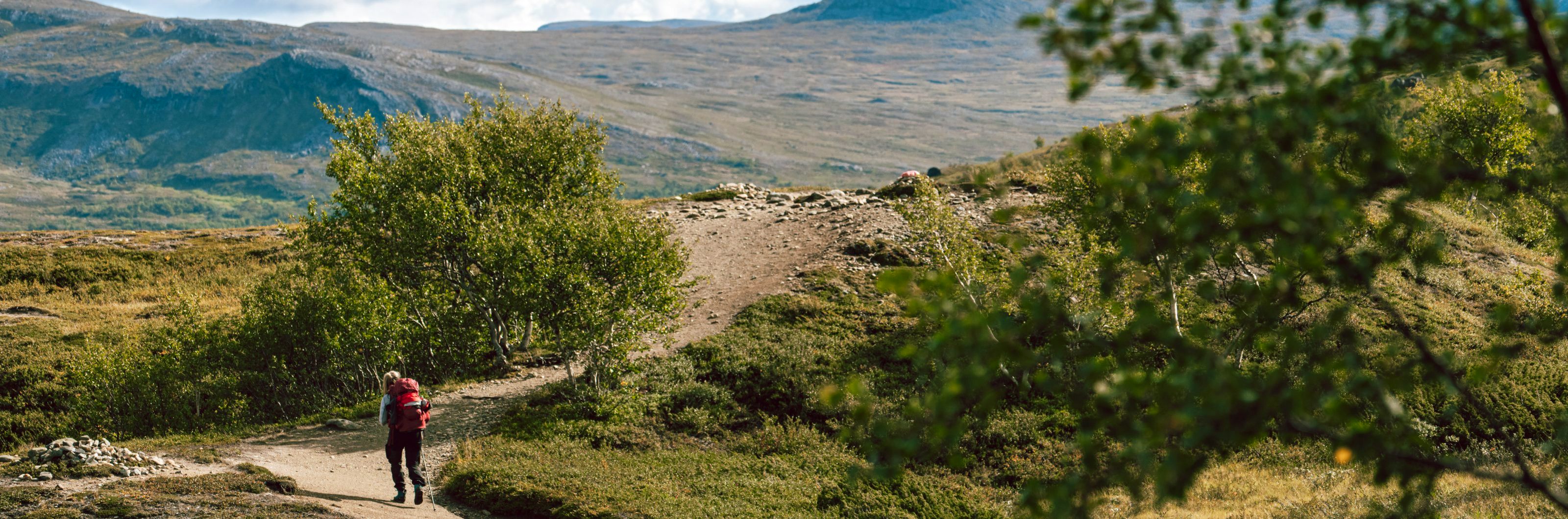 A woman hiking in the mountains.
