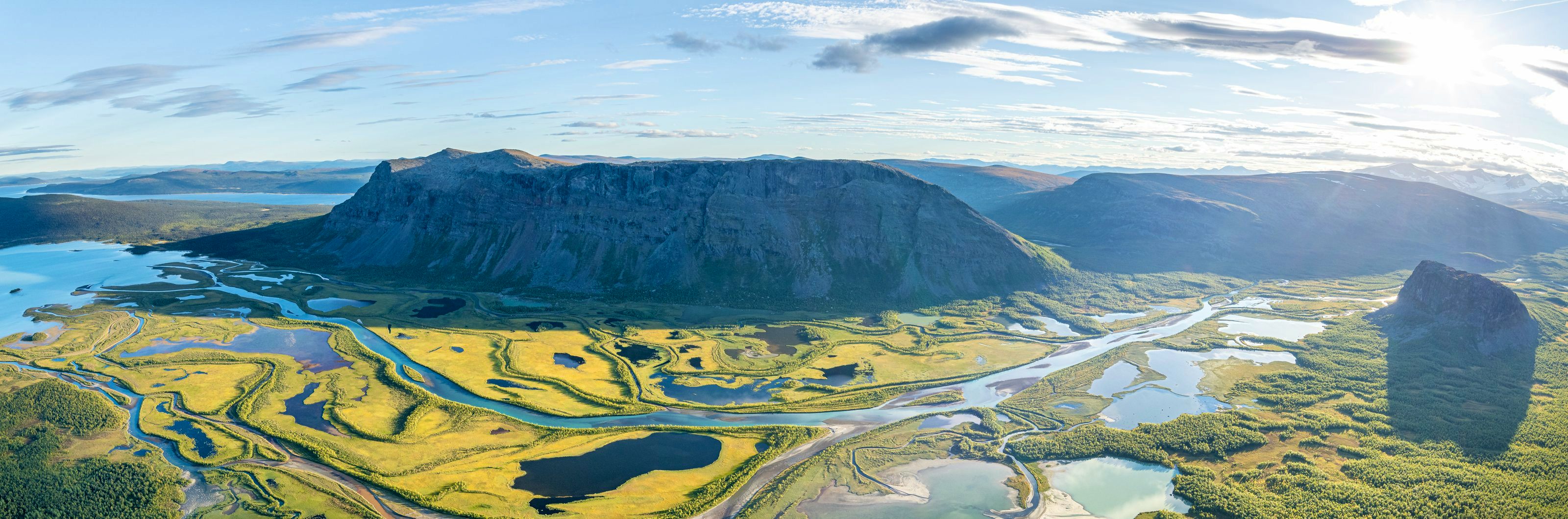 The mountains and river delta as seen from the Skierfe cliff, with views over the Sarek range.