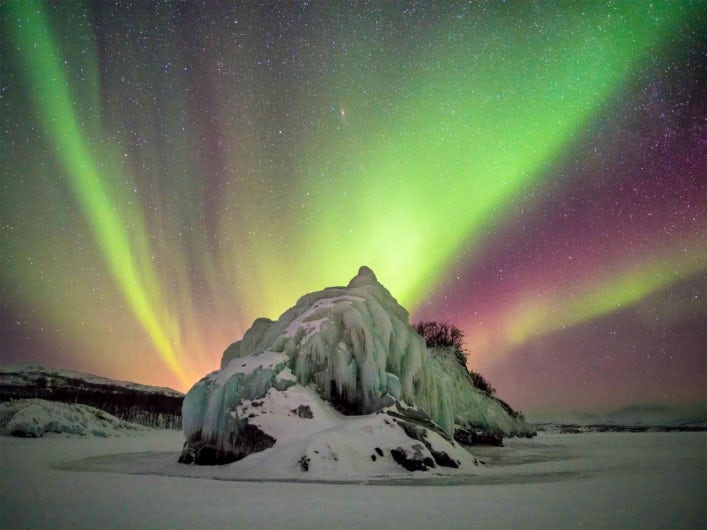 Green midnight light in a winterlandscape.