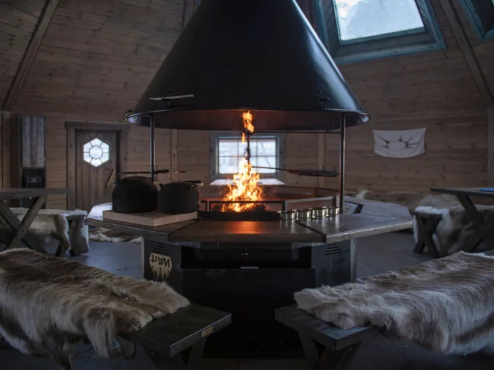 A fire burning inside of a wood burning stove.
